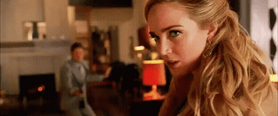 Woman With Blonde Hair In Living Room GIF