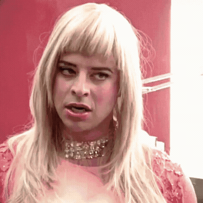 Woman With Blonde Hair In Pink Dress GIF