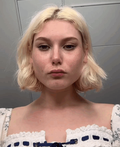 Woman With Blonde Hair In White Lace Dress GIF