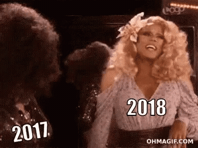 Woman With Blonde Hair Laughing Next To Man With Curly Hair GIF