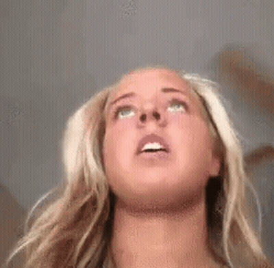 Woman With Blonde Hair Looking Up GIF