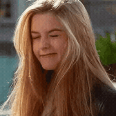 Woman With Blonde Hair Making Funny Face GIF