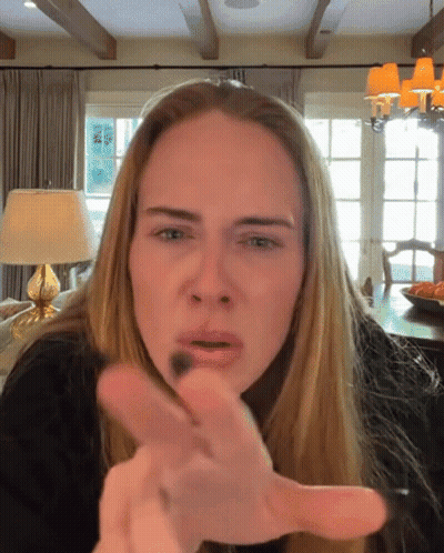 Woman With Blonde Hair Making Funny Face GIF