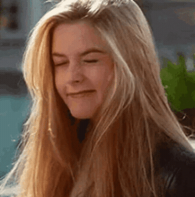 Woman With Blonde Hair Making Funny Face GIF
