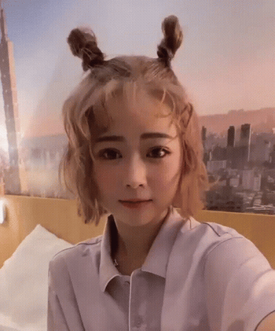 Woman With Blonde Hair Taking Selfie GIF