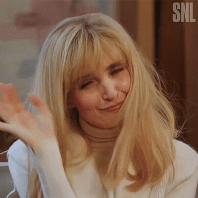 Woman With Blonde Hair Waving GIF