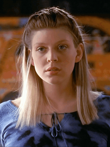 Woman With Blonde Hair Wearing Blue Shirt GIF
