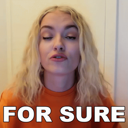 Woman With Blonde Hair Wearing For Sure Orange Shirt GIF