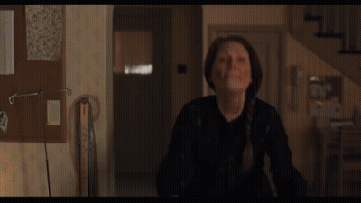 Woman With Blood On Face In Hallway GIF
