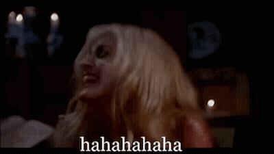 Woman With Blood On Face Laughing In Dark Room With Candles Hahahahaha GIF