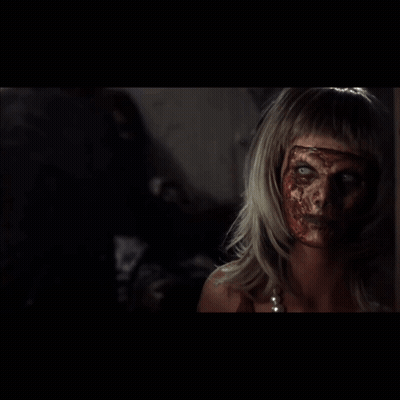 Woman With Blood On Face Looking In Mirror GIF