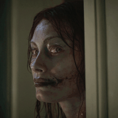 Woman With Blood On Face Smiling GIF