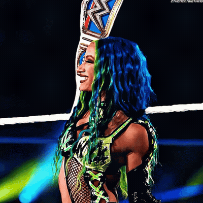 Woman With Blue And Green Hair Holding Wrestling Belt GIF
