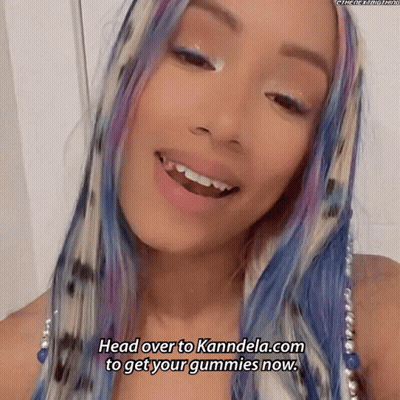 Woman With Blue And Purple Hair Smiling Says Head Over To Kannela.com To Get Your Gummies Now GIF