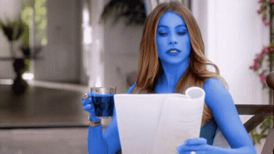 Woman With Blue Arms Reading Newspaper GIF