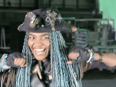 Woman With Blue Braids Wearing Hat And Gloves GIF