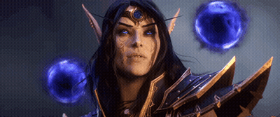 Woman With Blue Eyes And Crown Surrounded By Blue Spheres GIF