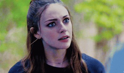Woman With Blue Eyes And Ponytail GIF