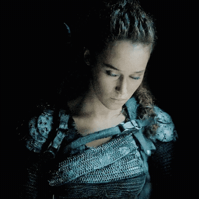 Woman With Blue Eyes In Chain Mail Armor GIF