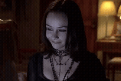 Woman With Blue Eyeshadow Smiling GIF
