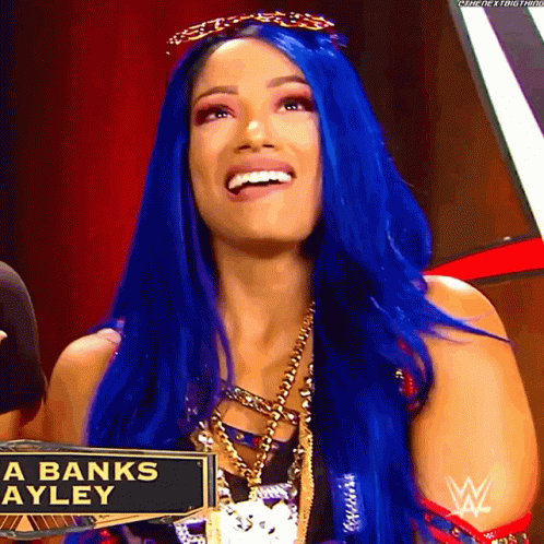 Woman With Blue Hair And Banks Ayley Sign GIF