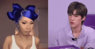 Woman With Blue Hair And Bow Beside Man In Purple Shirt GIF