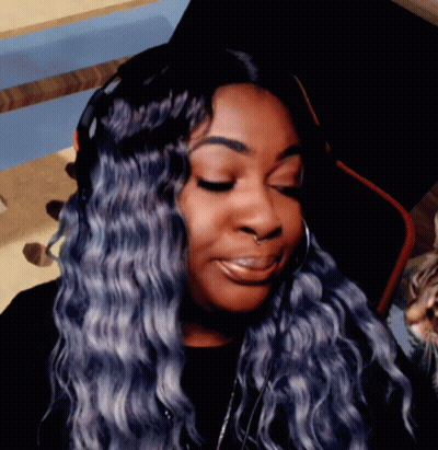 Woman With Blue Hair and Nose Ring Smiling