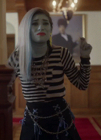 Woman With Blue Hair And Striped Shirt Before Man Portrait GIF