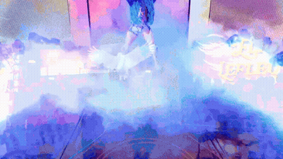 Woman With Blue Hair Dancing In Front Of Replay Sign GIF