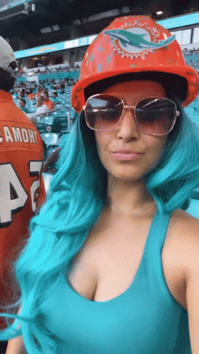 Woman With Blue Hair Hard Hat Sunglasses At Dolphins Game GIF