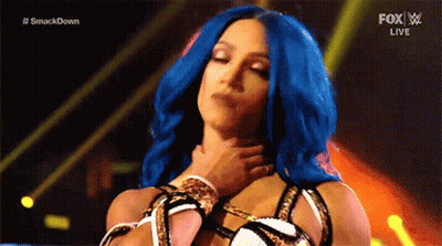 Woman With Blue Hair Held By Man On Stage GIF
