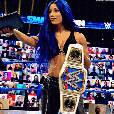 Woman With Blue Hair Holding Championship Belt GIF