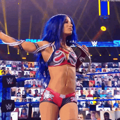 Woman With Blue Hair Holding Microphone At Wrestling Event GIF