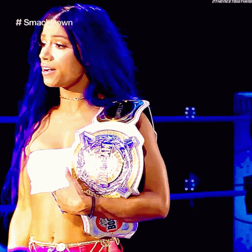 Woman with Blue Hair Holding Smackdown Championship