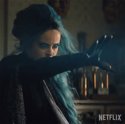 Woman With Blue Hair Holding Sword In Dark Room GIF
