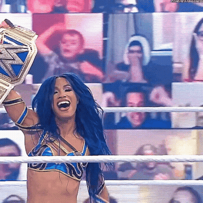 Woman With Blue Hair Holding Wrestling Championship Belt GIF