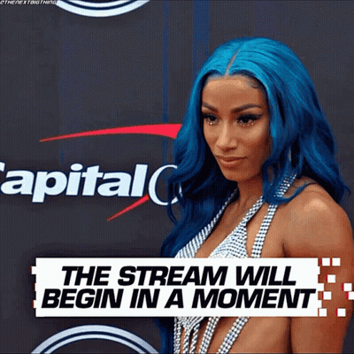 Woman With Blue Hair In Front Of Capital One Sign GIF