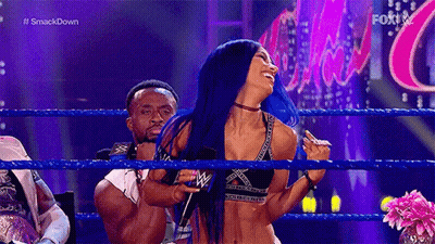 Woman With Blue Hair In Wrestling Ring Next To Man GIF