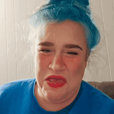 Woman With Blue Hair Making Funny Face GIF