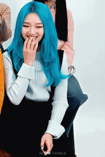 Woman With Blue Hair Smiling Hand To Mouth GIF