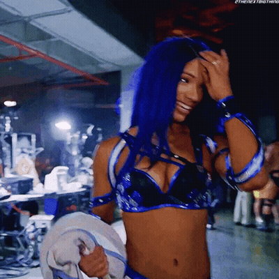 Woman With Blue Hair Smiling Holding Towel GIF