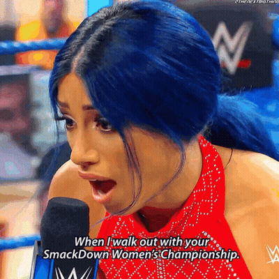 Woman With Blue Hair Talks Into Microphone Saying When I Walk Out With Your Smackdown Women's GIF