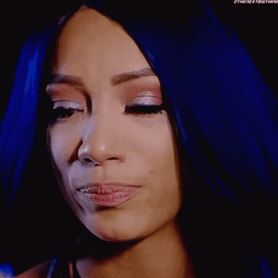 Woman With Blue Hair Wiping Eyes With Tissue GIF