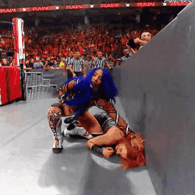 Woman With Blue Hair Wrestling Another Woman In Crowd GIF