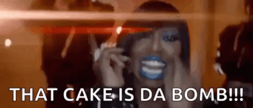 Woman With Blue Paint On Face Talking On Cell Phone That Cake Is Da Bomb GIF