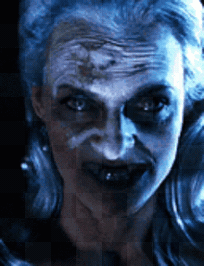 Woman With Blue Paint On Face GIF
