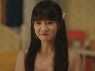 Woman With Bow In Hair Looking GIF