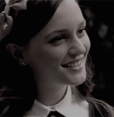 Woman With Bow Smiling GIF