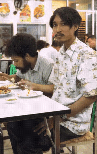 Woman With Braces Making Heart Shape GIF
