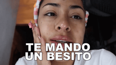 Woman With Braces Saying Te Mando Un Besito GIF